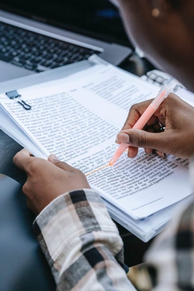 Person highlighting a passage.