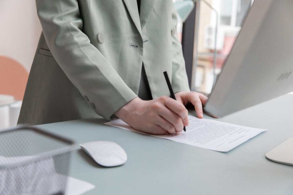 A person signing a legal document.