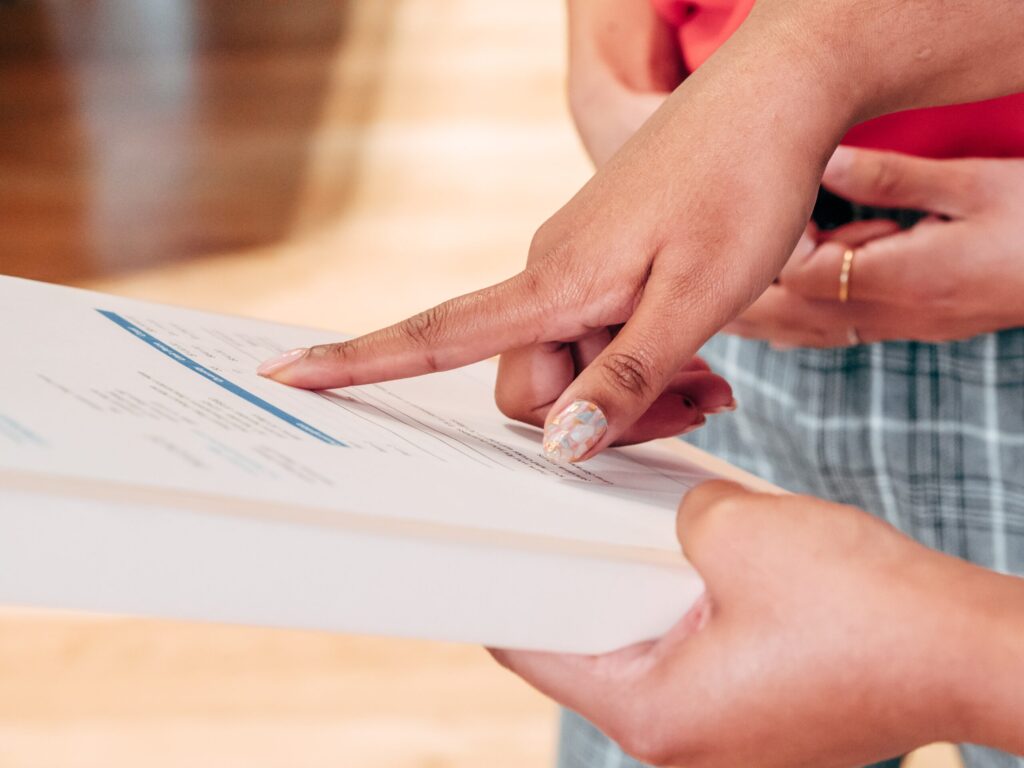 Two people reviewing a document.