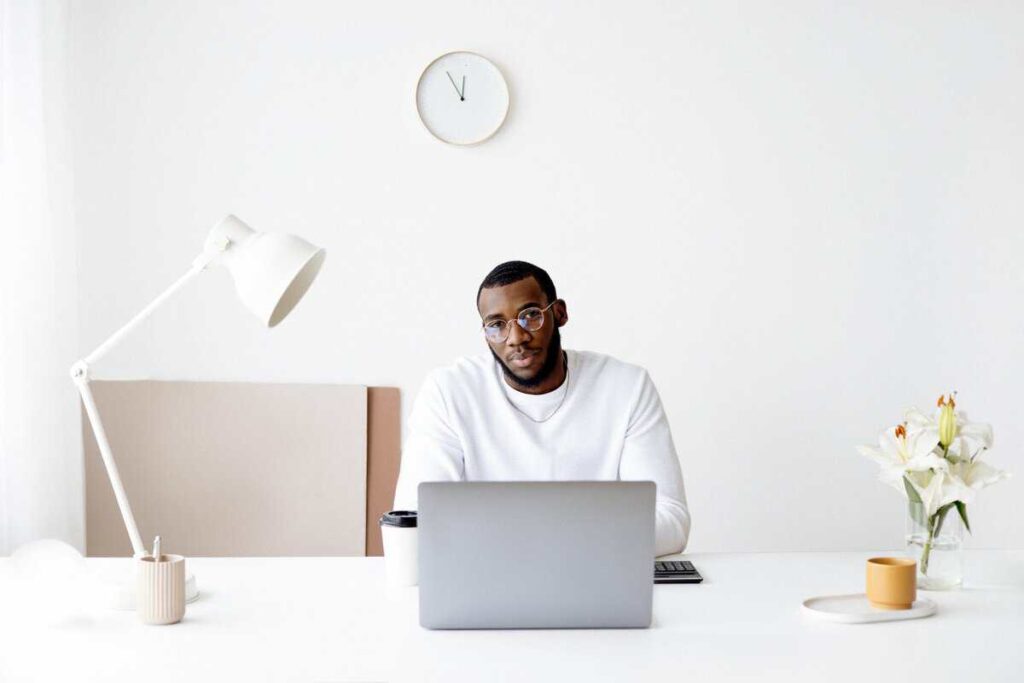 A person sitting at a computer desk.