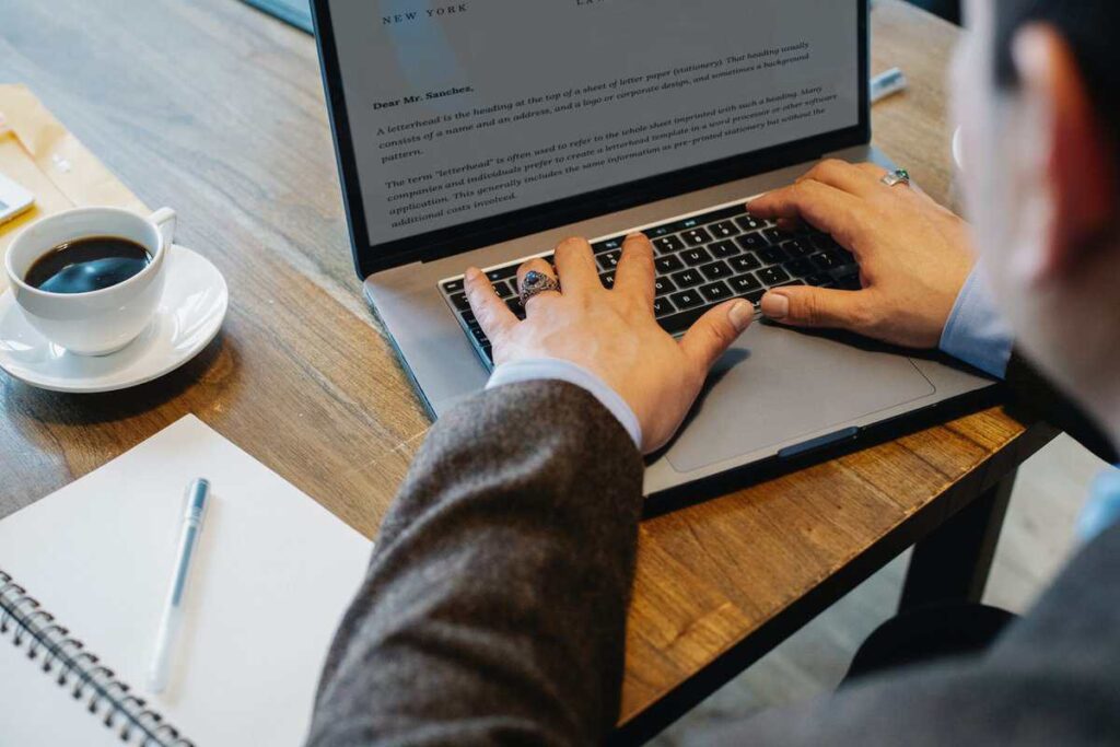A person using a computer to research.